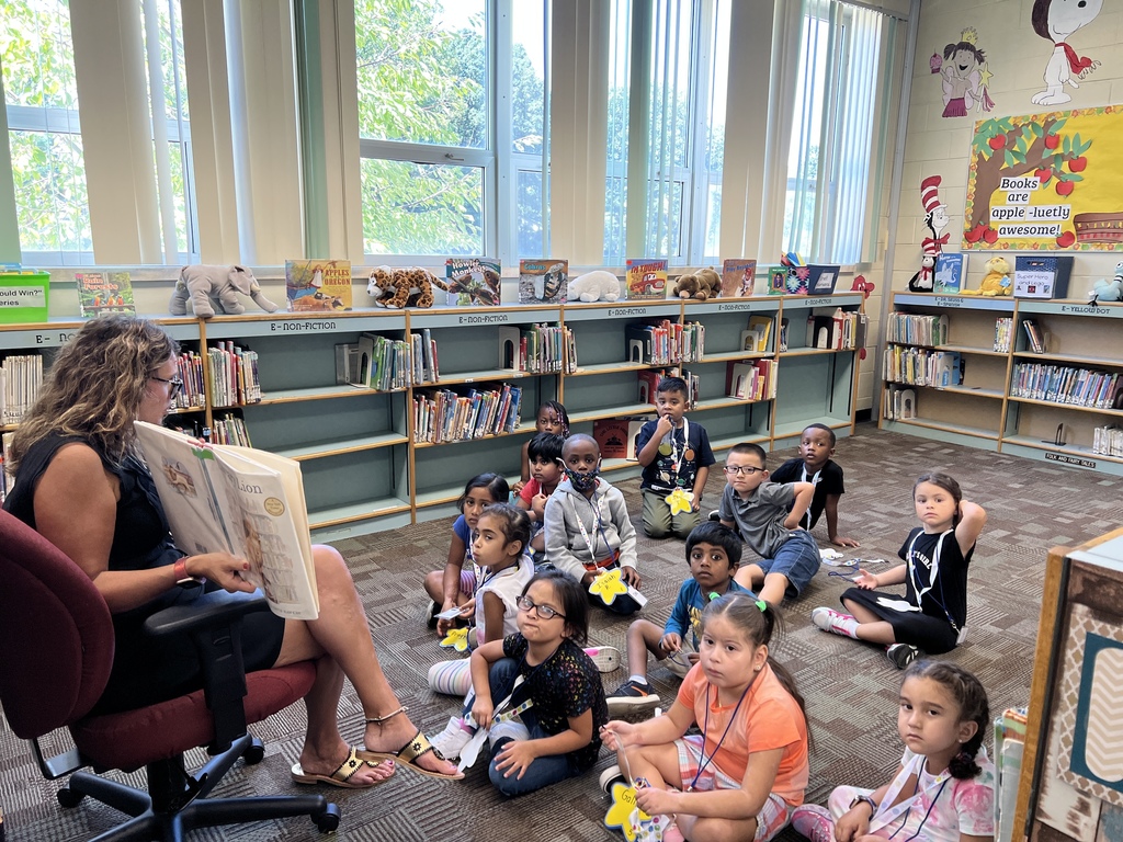 JA students hear a story in the library.
